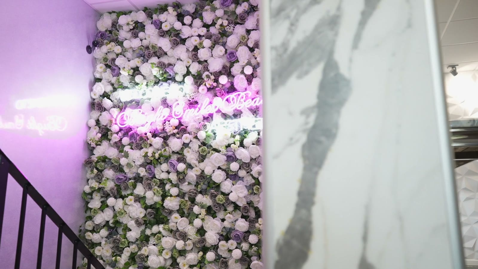 Our neon flower wall at Bright Smiles Beauty